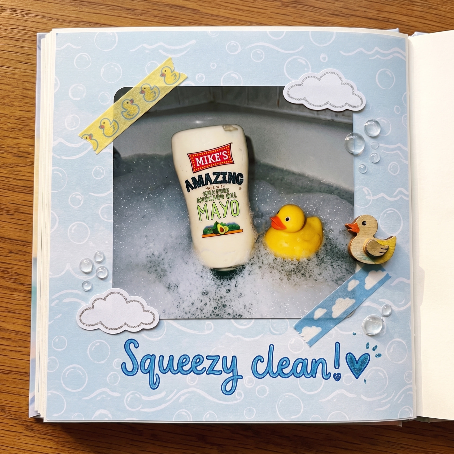 Mike's Amazing avocado oil mayo bottle in a bubble bath with rubber ducks